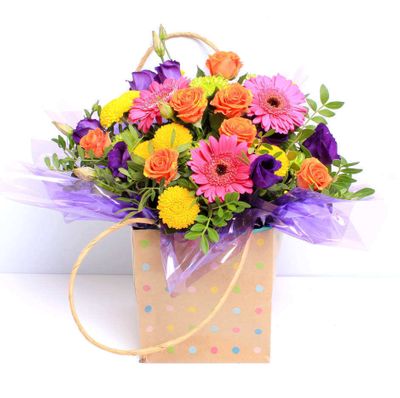 A vibrant bundle of blooms with all the fun of the carnival. Enjoy flowers at their brightest!